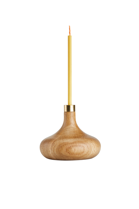 Oiled oak candle stick holder with brass detail and slim beeswax candle.