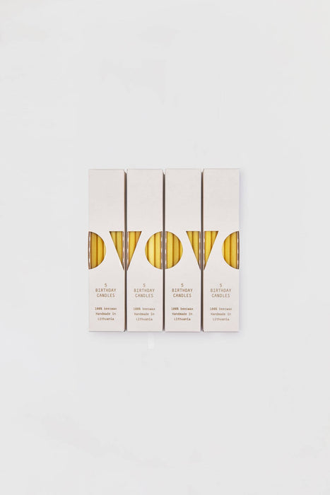 Four packages of 100% Beeswax Birthday candles from pure beeswax with multicolored cotton wicks.