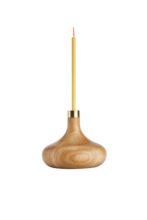 Oiled oak candle stick holder with brass detail and slim beeswax candle.