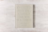A hardcover coffee table book with a beige linen cover and gloss pigment foil, featuring 101 quotes by Brianna Wiest that will change the way you think.