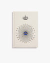 Book titled 'The Life Designer' with a decorative cover on a white background