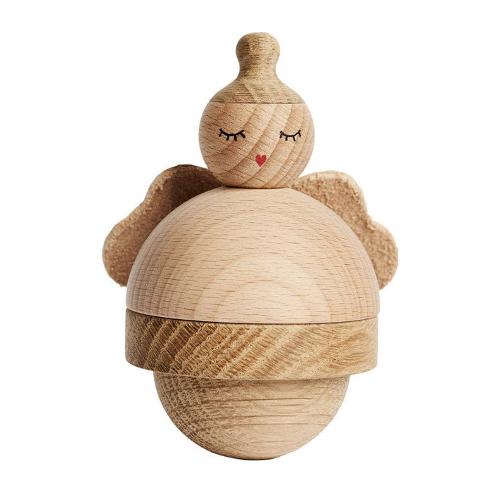 Wooden acorn-shaped toy with a face on a white background. Angel Figurine. Holiday Decor