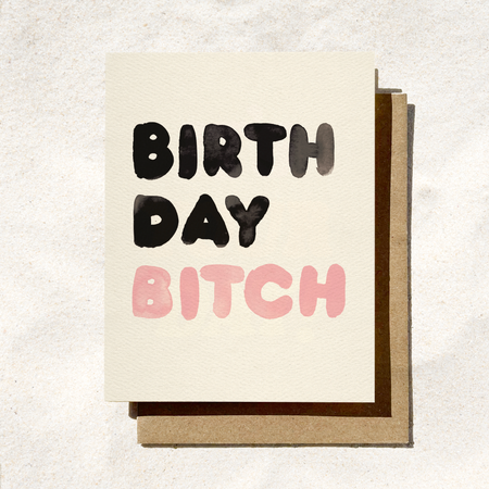 Birthday card with 'Birthday Bitch' text on a textured surface