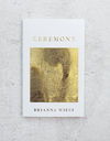 A book titled 'Ceremony' by Brianna Wiest with a white and gold cover design.