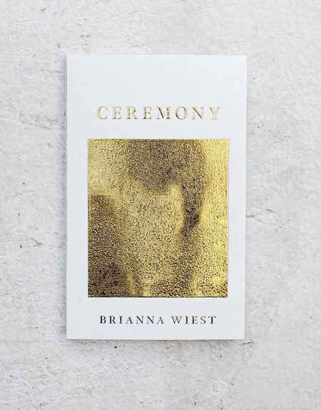 A book titled 'Ceremony' by Brianna Wiest with a white and gold cover design.