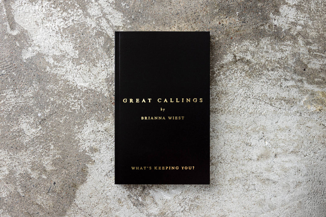 Black book titled 'Great Callings by Brianna Wiest' on a textured gray surface