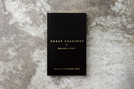 Black book titled 'Great Callings by Brianna Wiest' on a textured gray surface