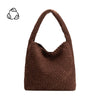 Brown woven handbag on a white background