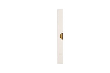 A single beige-colored candle on a white background, potentially representing the product being sold.