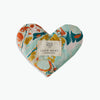 A heart-shaped 'Eye Love Pillow' with a marbled pattern of blues and pinks and the brand label 'LOVE MERT' attached to it.