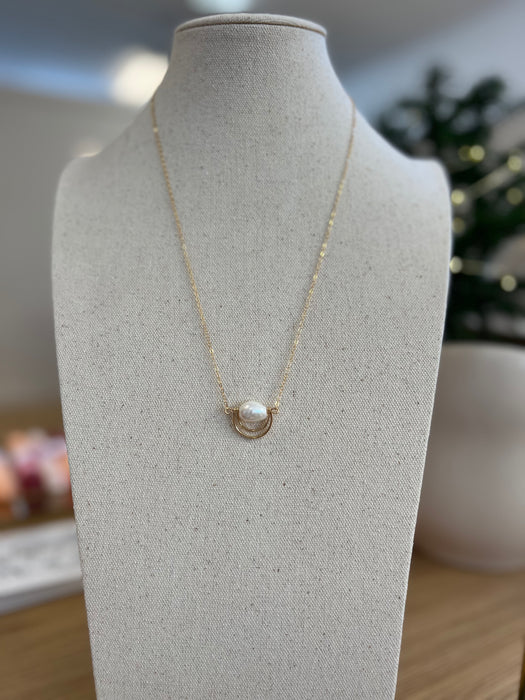 Dainty 14k gold-filled necklace with freshwater pearl paired with a captivating rainbow pendant.