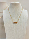 14K gold-filled necklace with ten Peach Moonstone square charms, side by side stacked on a bar. 