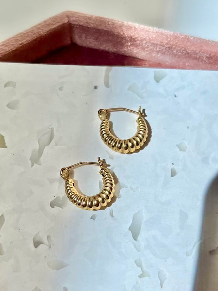 Scalloped Hoop earrings made from 14k gold-filled material.