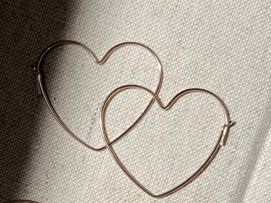 Heart Hoop Earrings made out of 14k gold filled material.