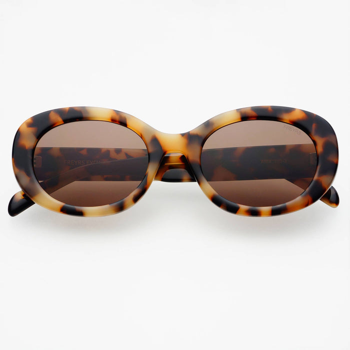 Tortoiseshell sunglasses with brown lenses on a white background