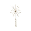 Decorative gold starburst ornament on a white background