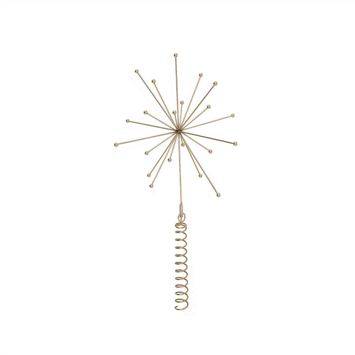 Decorative gold starburst ornament on a white background