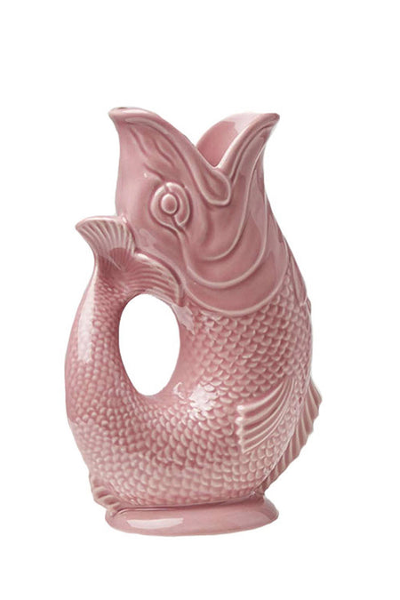 A pink ceramic jug designed to resemble a fish.