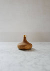 Oiled oak candle stick holder with brass detail.