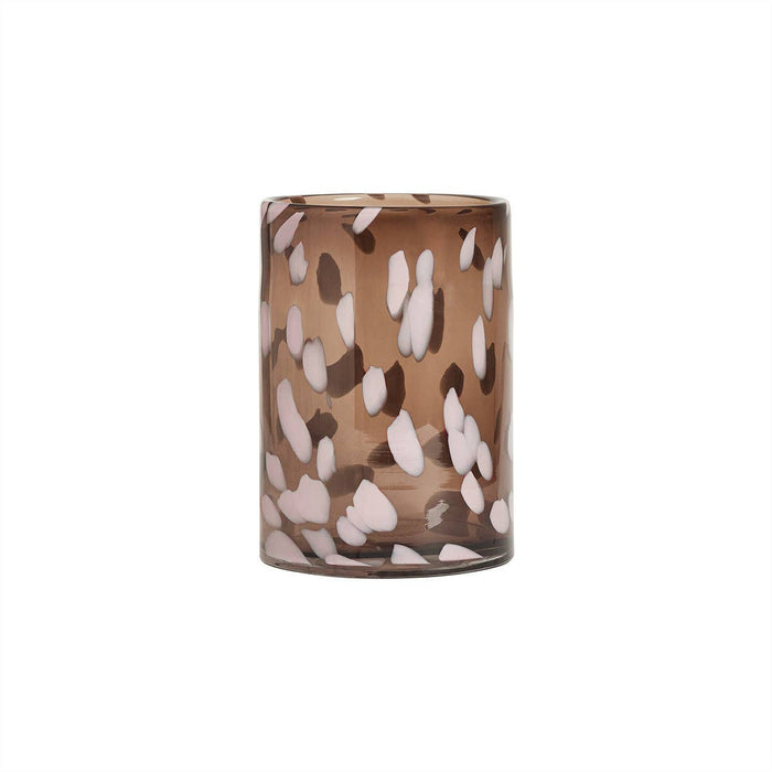 Decorative glass vase with a brown and white pattern on a white background