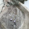 14-k gold-filled drop earring adorned with purple freshwater pearl.