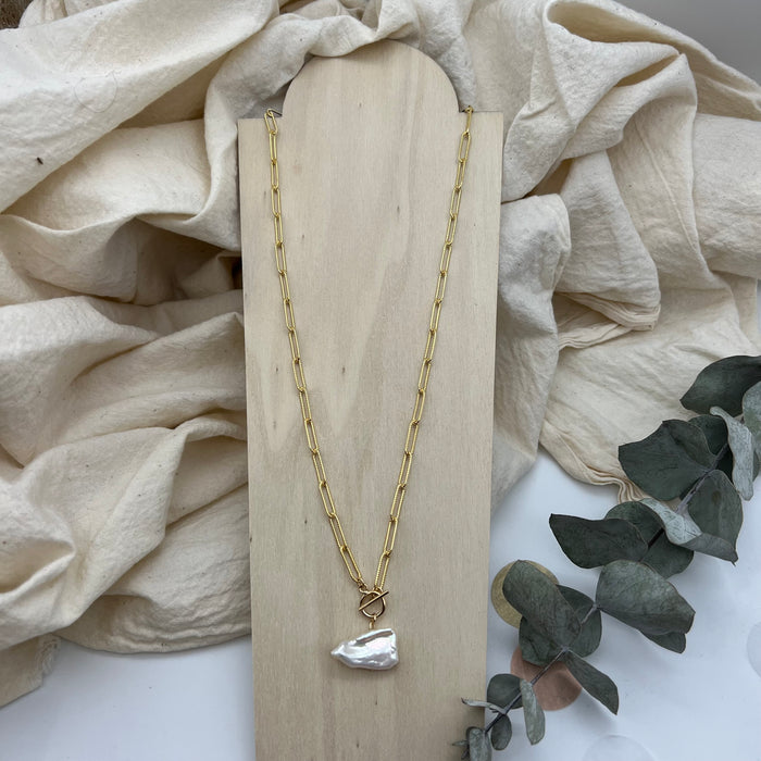 Paperclip gold-filled chain with an uniquely shaped freshwater pearl.